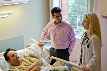 Patient Isidro Hernandes communicates with Dr. Angela Alday through Spanish interpreter Armando Jimenez. (Photo by Tuality Healthcare/Jeff Schilling)