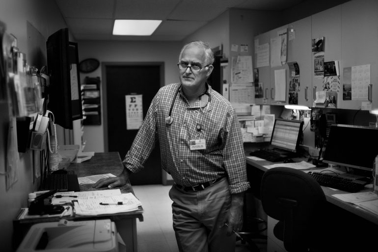 Dr. Tim Alford in his clinic in the central Mississippi town of Kosciusko. The hospital across the street has had to lay off staff and shutter its I.C.U. (Photo by Jon Lowenstein)
