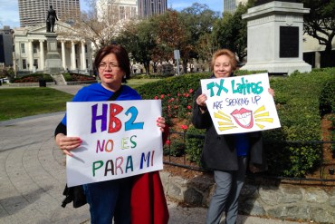 Lucy Felix, left, and Celeste Martinez of Brownsville, Texas rally outside the Fifth Circuit Court of Appeals in New Orleans. The women oppose the controversial Texas abortion, House Bill 2, which was being reviewed Wednesday at the courthouse. (Photo by Carrie Feibel)