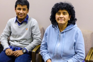 Daniel Palacios, 17, and his aunt, Lusmila Morales, 53, wait for enrollment assistance at Legal Services of Northern Virginia in Arlington, Va.  Morales, of Falls Church, Va., wants coverage so she can get a physical (Photo by Mary Agnes Carey/KHN).