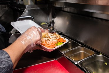 Elba Ramirez, 44, prepares a chicken salad plate at her food truck in Los Angeles, California, on Wednesday, February 4, 2015. Ramirez says it has become a popular option with customers (Photo by Heidi de Marco/KHN).