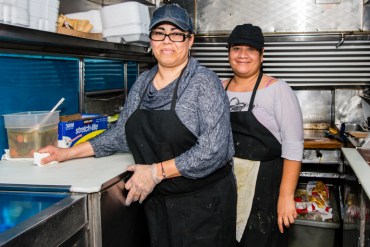 Elba Ramirez, 44, owner of Lily’s Catering food truck and her cook Gladys Martinez, 39, at the end of their lunch shift (Photo by Heidi de Marco/KHN).
