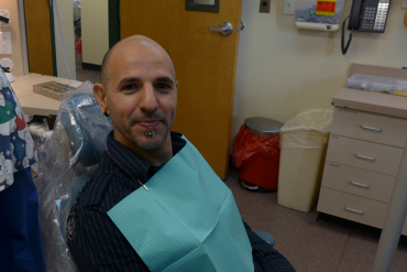 After snagging an appointment through a monthly lottery, Pavel Poliakov waits to see a dentist at the Health District of Northern Larimer County  clinic in Fort Collins, Colo. (Photo: Phil Galewitz/Kaiser Health News)