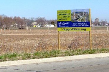 A sign marks the location of a proposed new St. Elizabeth’s hospital in O’Fallon, Mo., on 114 acres of farmland just off Interstate 64. (Photo by Phil Galewitz/KHN) 