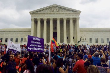 Demonstrators gather outside the Supreme Court Friday, June 26 after the court decided that same-sex couples around the nation could marry. (Photo by Alana Pockros/KHN)