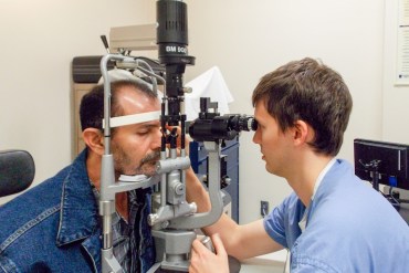Patient Antonio Camargo gets an eye exam at the ophthalmology clinic at Los Angeles County Harbor-UCLA Medical Center on June 9, 2015. Camargo, 49, said he waited months for his first surgery, a corneal transplant, but his next operation happened within days. (Photo by Anna Gorman/KHN)