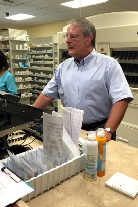 Pharmacist Bill Napier hired a lawyer to do criminal background checks on his painkiller patients to help him decide who to dismiss. (Photo by Jessica Palombo/For KHN)