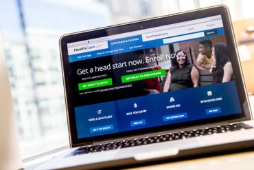 The healthcare.gov website, where people can buy health insurance, is displayed on a laptop screen. (Photo by Andrew Harnik/AP)