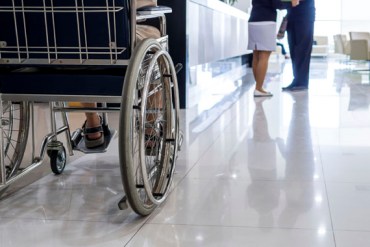 Closeup of elderly man on wheelchair in hospital