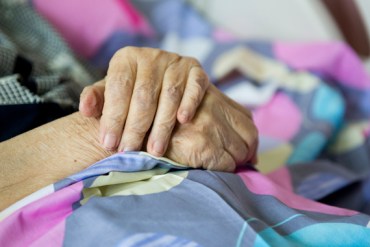 wrinkled hands of old woman.