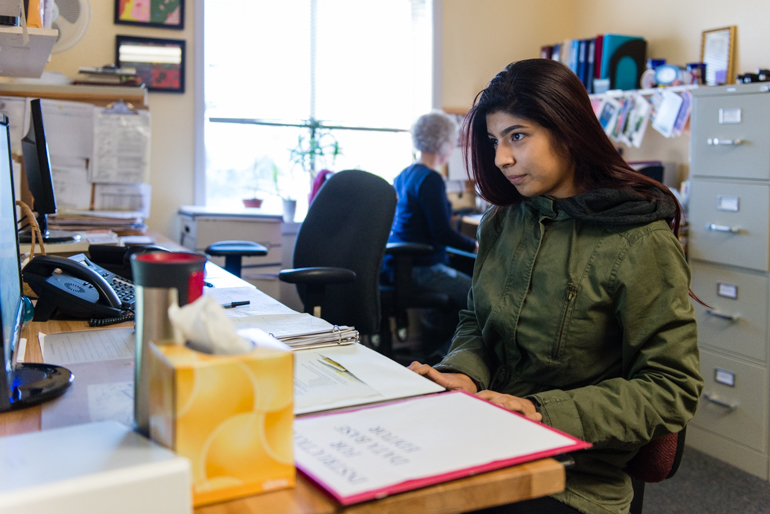 Nubia Flores Miranda, 18, works part-time at Family Paths, a counseling and mental health organization in Oakland, Calif., on Friday, January 29, 2016. Miranda said she became interested in a career in mental health after she started experiencing depression and anxiety her freshman year at Life Academy of Health and Bioscience. (Heidi de Marco/KHN)