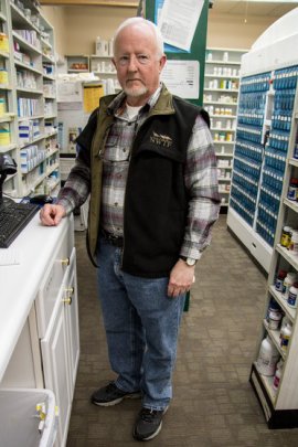 At Richard Logan's pharmacy in Charleston, Mo., prescription opioid painkillers are locked in a cabinet. For 20 years, he's also been a reserve deputy with two local sheriff's departments, investigating prescription drug abuse. Bram Sable-Smith/Side Effects Public Media/KBIA