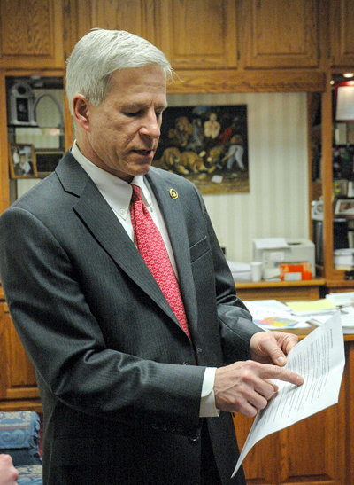 State Sen. Rob Schaaf points to evidence in support of his opposition to the database bill in his office at the Missouri State Capitol. He said the bill interfered with the right to medical privacy. Jiselle Macalaguin/KOMU/ Flickr