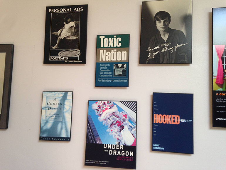 The wall of Lonny Shavelson’s office, lined with covers of the books he has written. (Lisa Aliferis/KQED)
