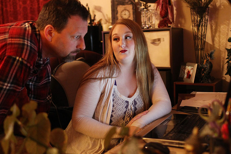 Shariah Vroman-Nagy and her father, Tom Nagy, at their home in Redding, Calif. (Andreas Fuhrmann/KQED)