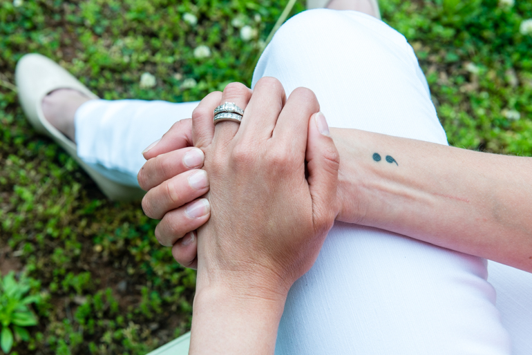 Powell has a semicolon tattoo on her right wrist. The tattoo refers to Project Semicolon, a nonprofit that aims to provide hope for those struggling with mental illness. (Heidi de Marco/KHN)