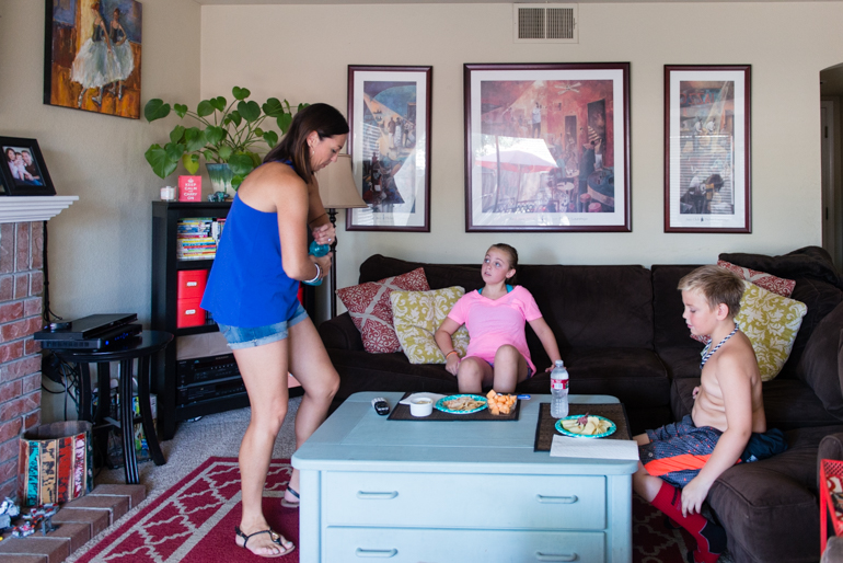 Jamie Hancock, 38, serves lunch to her children Blythe, 9, and Andrew, 7, on June 30, 2016. Hancock said she lost the cognitive ability to do certain tasks which made it difficult to keep her full-time, office job. (Heidi de Marco/KHN) 