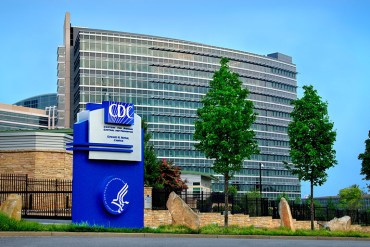 2005 James Gathany This photograph depicted an exterior view of Building 21, located at the Centers for Disease Control and Prevention, CDC, headquarters, also referred to as the Roybal Campus. Situated in Atlanta, Georgia, this view was from the campus’ entrance. From downtown Atlanta, the CDC moved its location to Clifton Road after earlier construction had been completed in 1960. In 1947, Emory University donated the land on Clifton Road for the organization’s new headquarters.