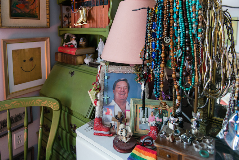 A photo of Dehag’s partner sits on the dresser in his bedroom. Dehag moved into one of the apartments shortly after his partner passed away. (Heidi de Marco/KHN)