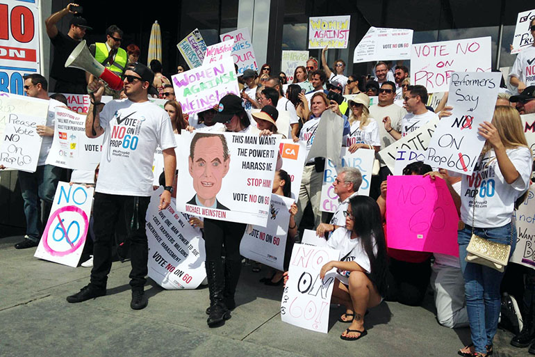 Adult film performers rally against Proposition 60 outside Michael Weinstein’s office. (April Dembosky/KQED)