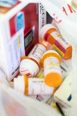 Estrada-Medina carries her medication with her in a worn plastic grocery bag. She says it took her more than 3 months to complete the paperwork to get her Medicaid approved after she was released from prison, and in that time she had trouble getting her prescriptions filled. (Philip Scott Andrews/ For KHN)