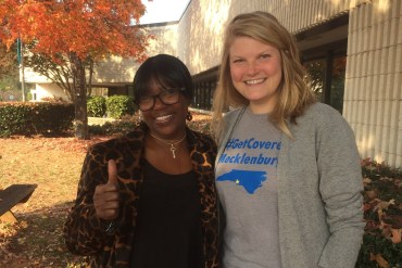 Darlene Hawes (left) and her enrollment counselor, Julieanne Taylor, outside the Mecklenburg County Health Department in Charlotte, N.C. (Michael Tomsic/WFAE)