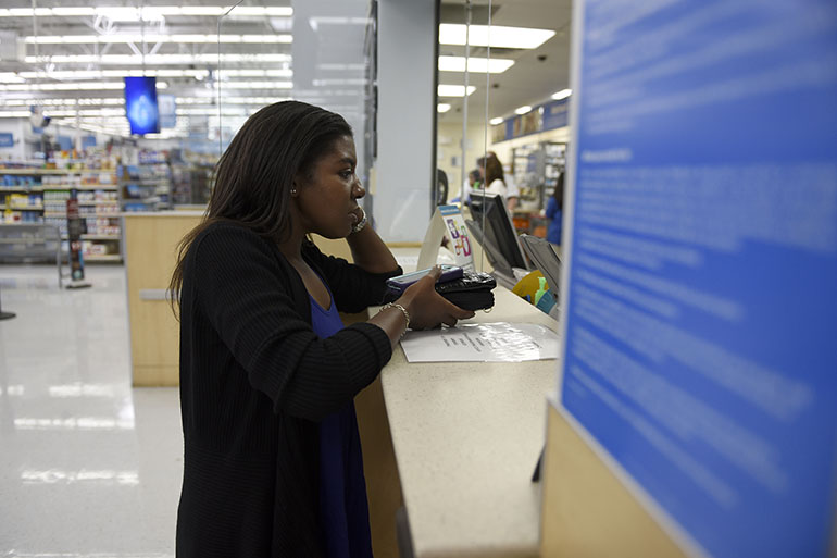 Sharissa Derricott waits to renew her prescriptions in Lawton, Okla., to treat several conditions she says have plagued her since taking Lupron to slow her puberty at a young age. (Nick Oxford/for KHN)