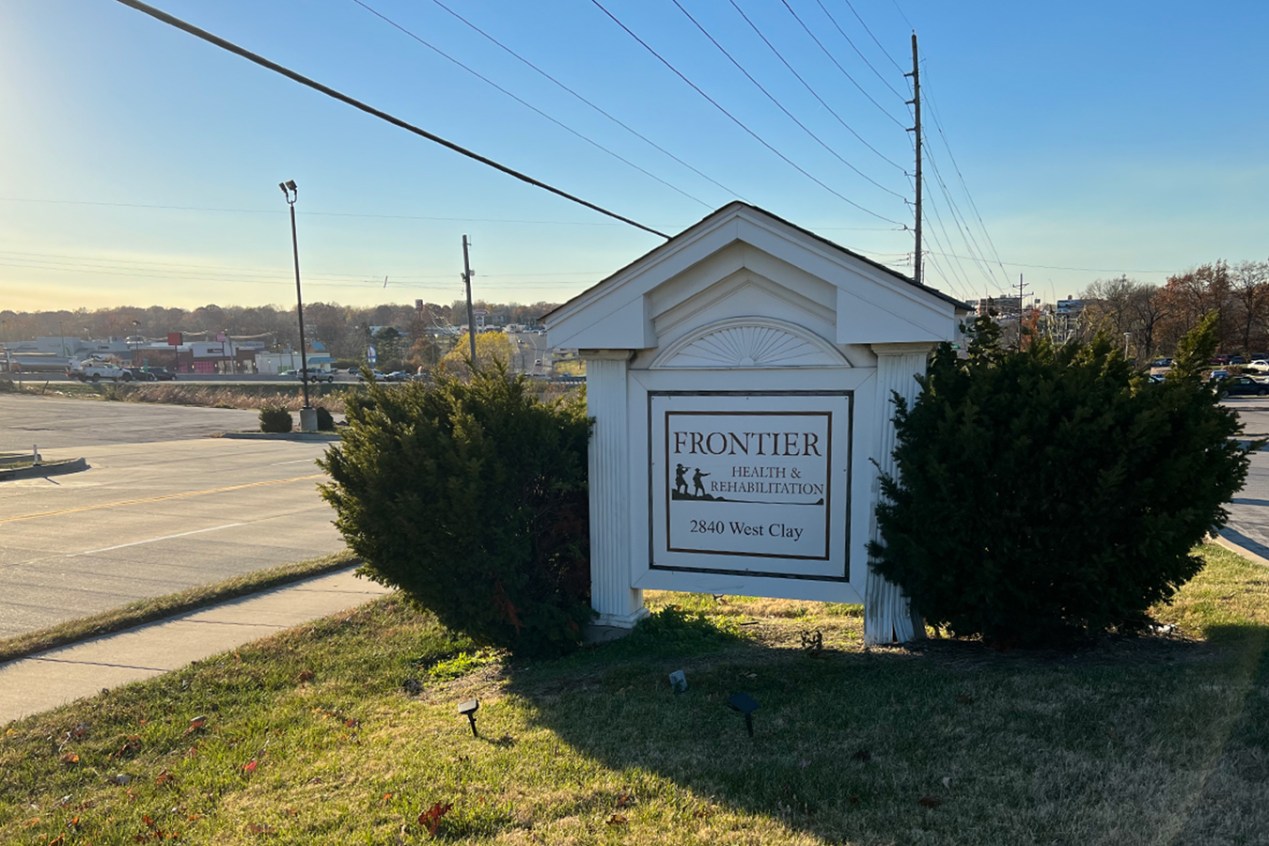A sign shows the name of Frontier Health & Rehabilitation, a nursing home in St. Charles, Missouri.