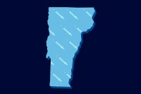 The outline of Vermont is seen superimposed with syringes.