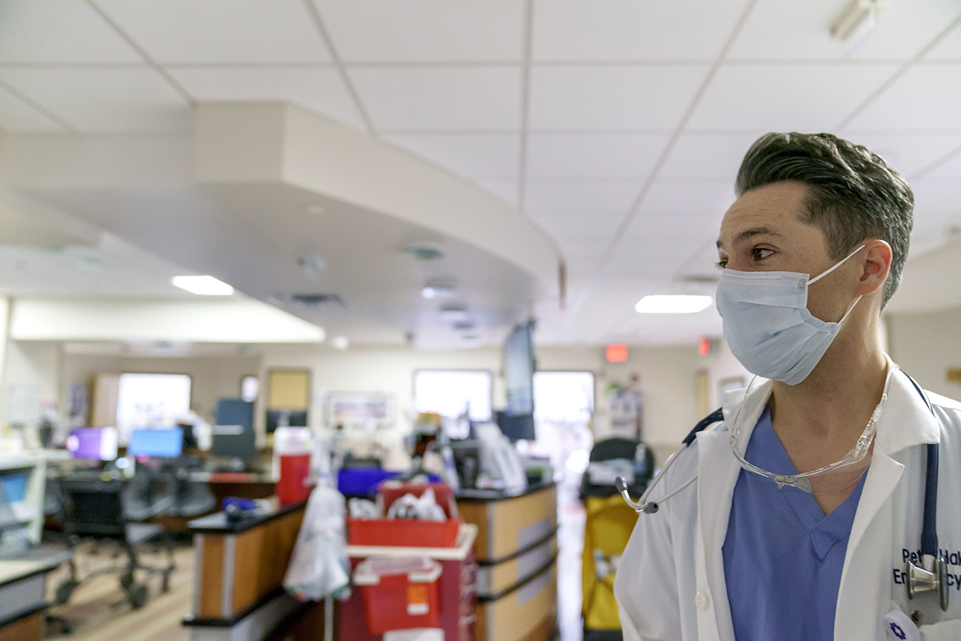 A male doctor stands in the hospital emergency department