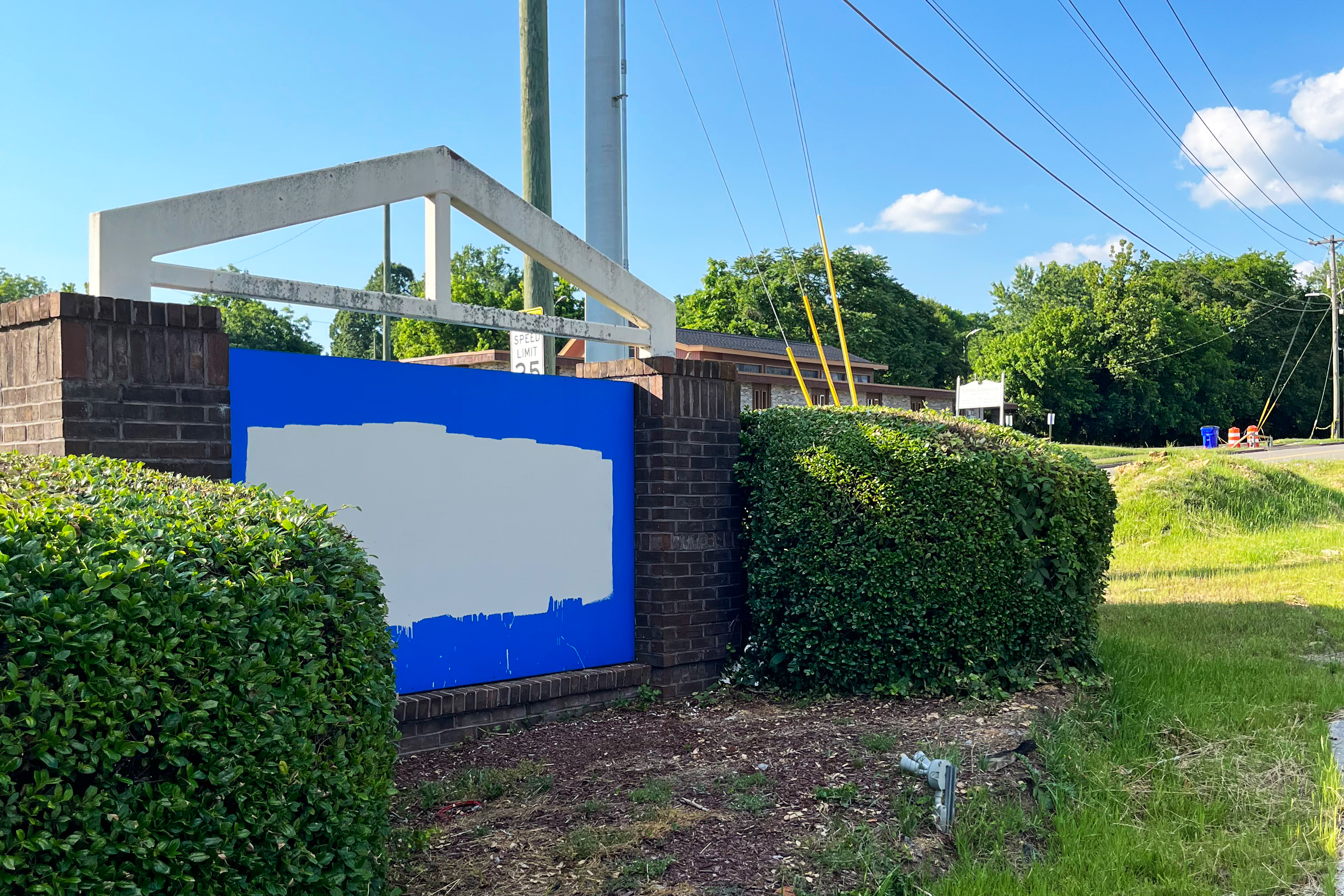 A photo shows the vandalized sign outside of the site where the Knoxville Planned Parenthood clinic stood. White paint covers a section of the sign.