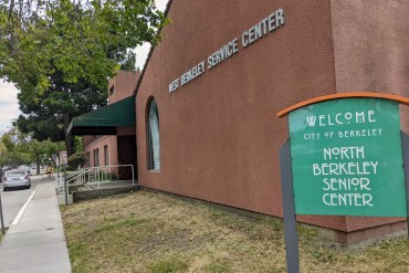 A photo shows the exterior of West Berkeley OptumServe. A sign out front reads, "North Berkeley Senior Center."