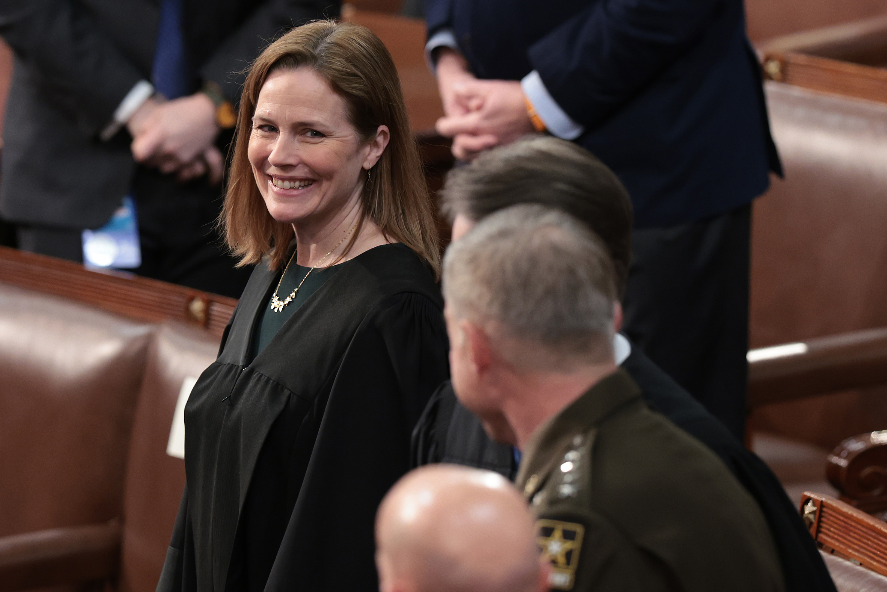 Justice Amy Coney Barrett is seen speaking to other justices before the State of the Union address.