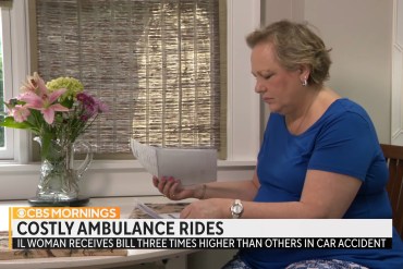 A screenshot from a TV broadcast shows Peggy Dula looking through medical bills. Text overlaid on the screen reads, "Costly ambulance rides."
