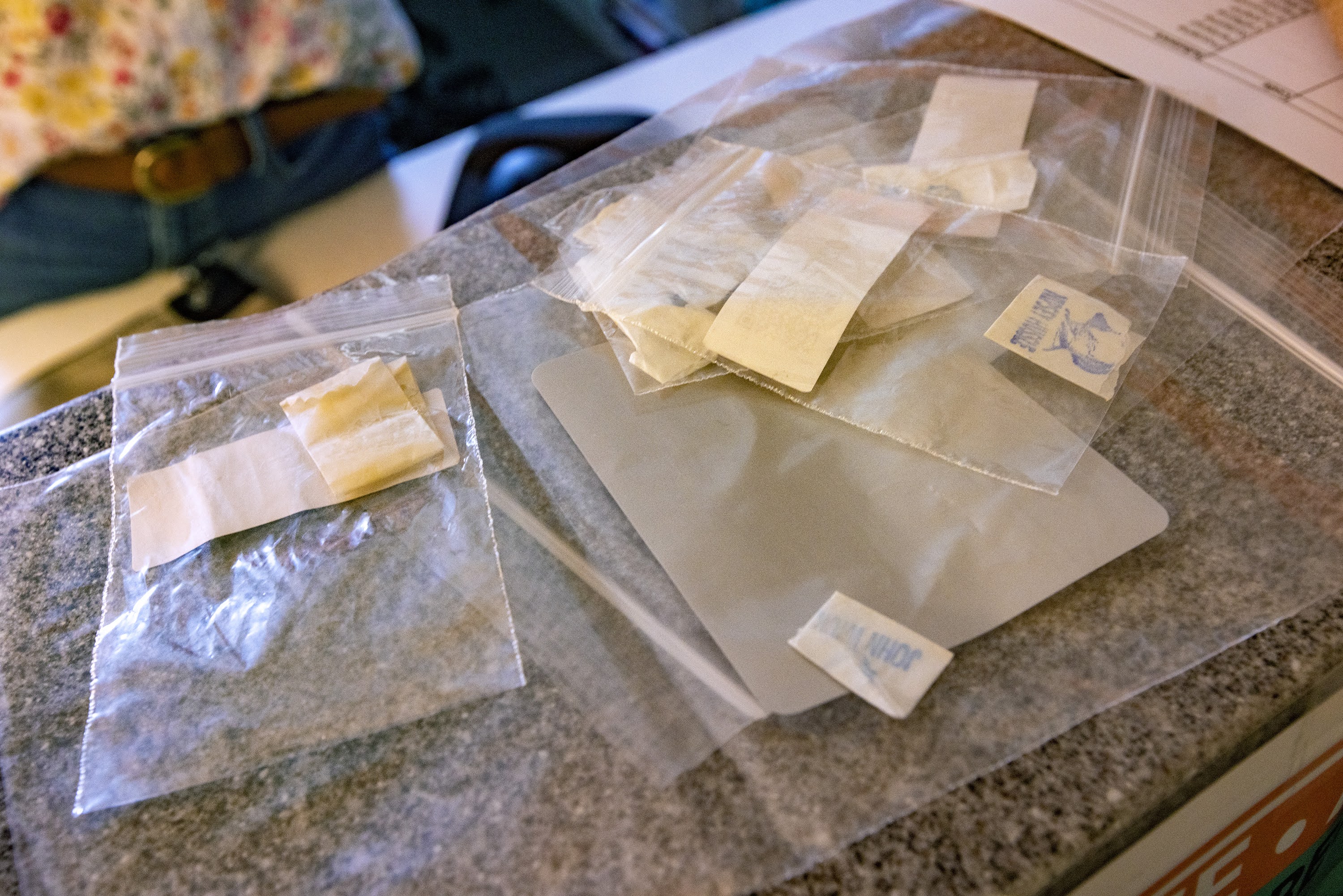 A photo shows samples of illegal drugs in small plastic bags for testing.