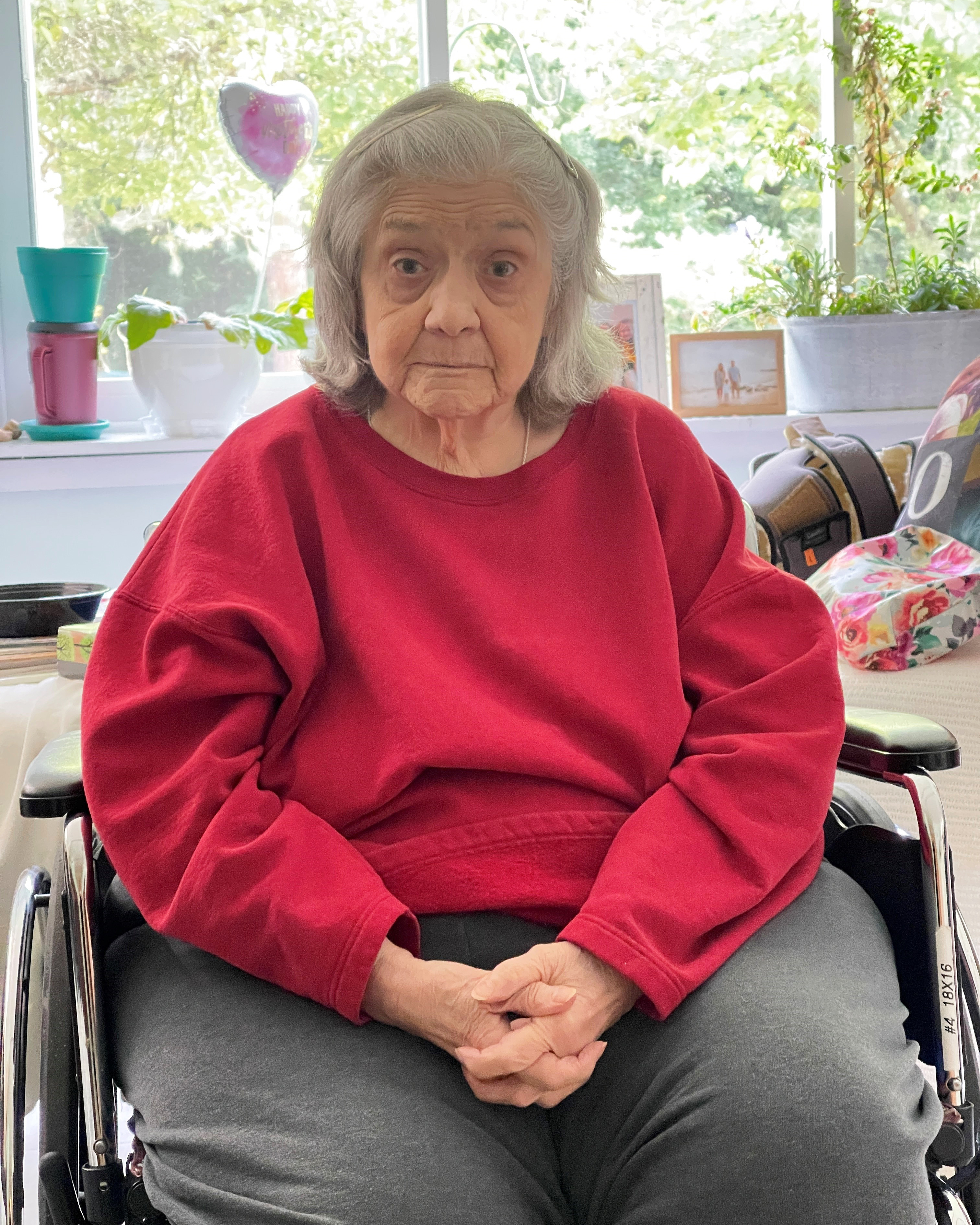 A photo shows Patricia Maynard sitting in a wheelchair.
