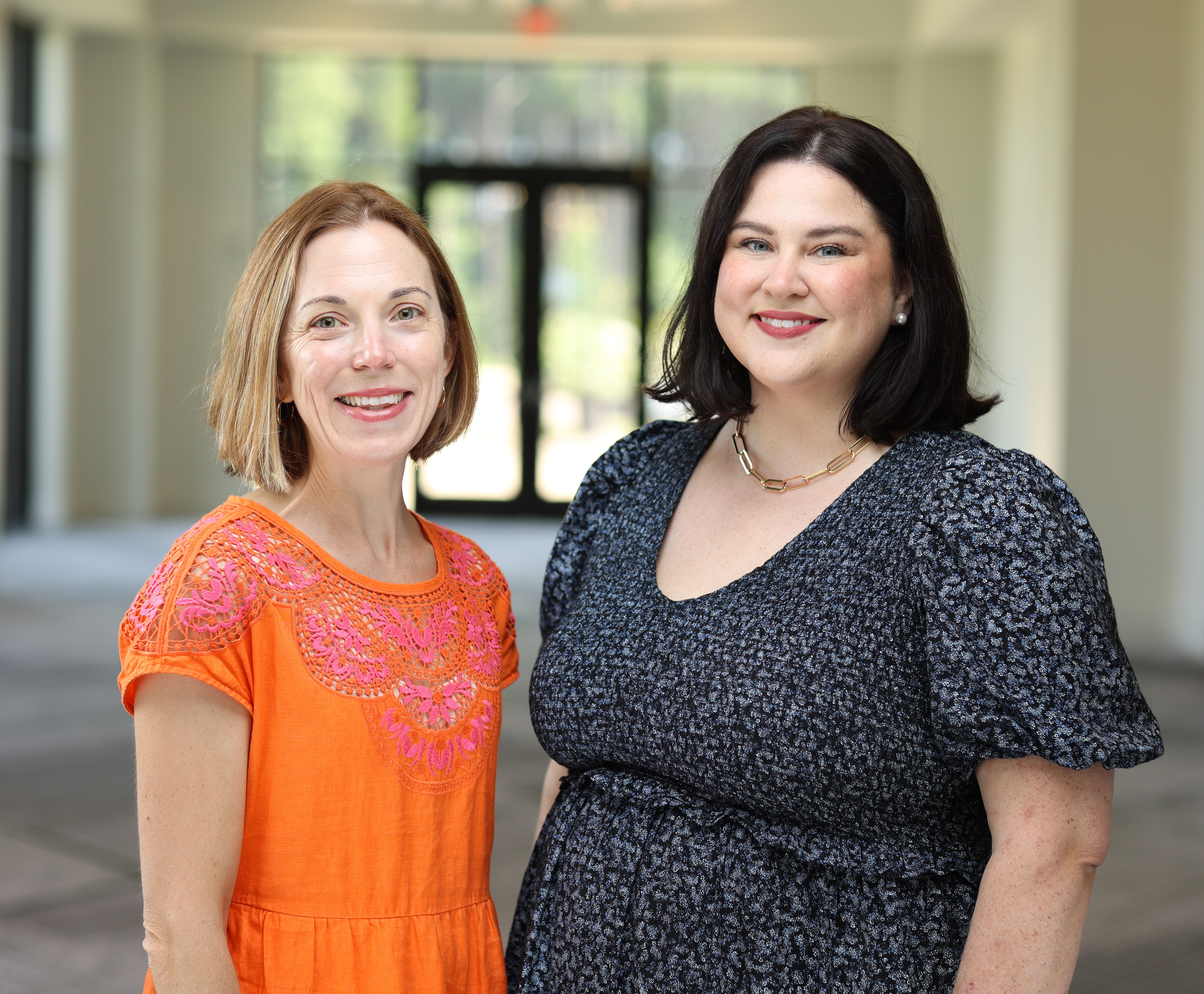 A photo shows Jamie Bardwell and Danielle Lampton posing for a portrait together.