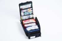 A photo shows an open airline medical kit.