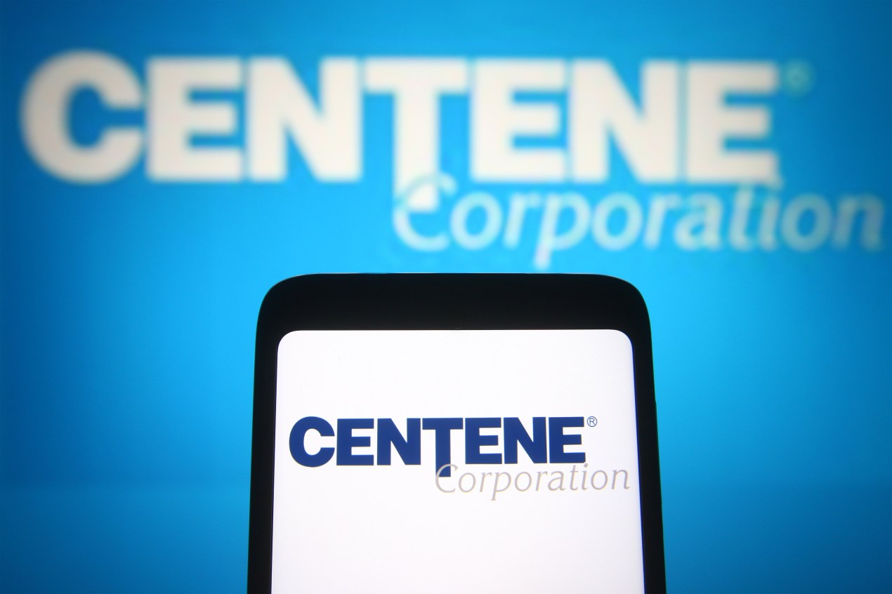 A photo shows Centene's logo on both a cellphone and computer screen.