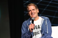 A photo shows Mark Cuban speaking into a microphone at a tech conference.