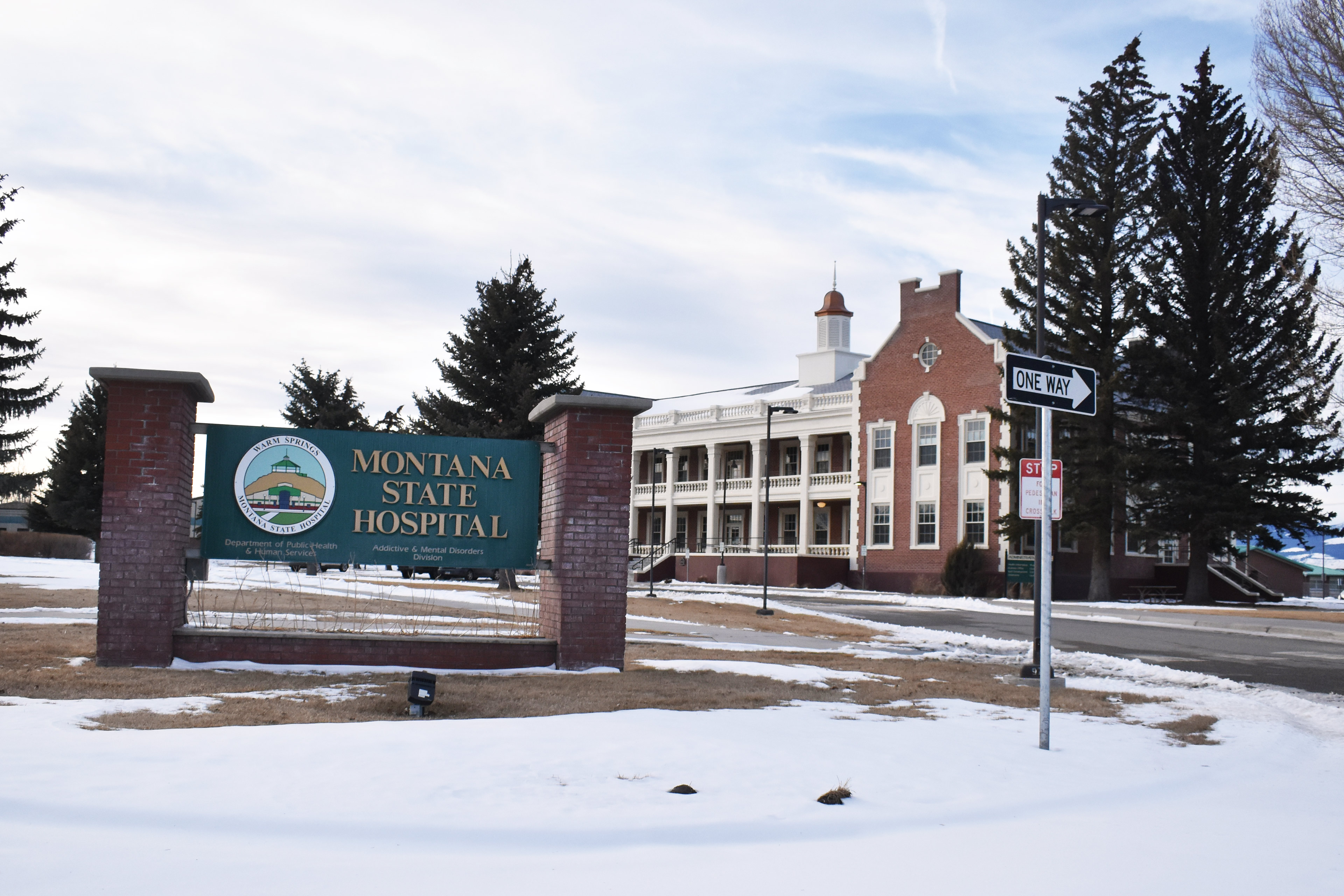 A photo shows a hospital building with a sign in front that reads, "Montana State Hospital."