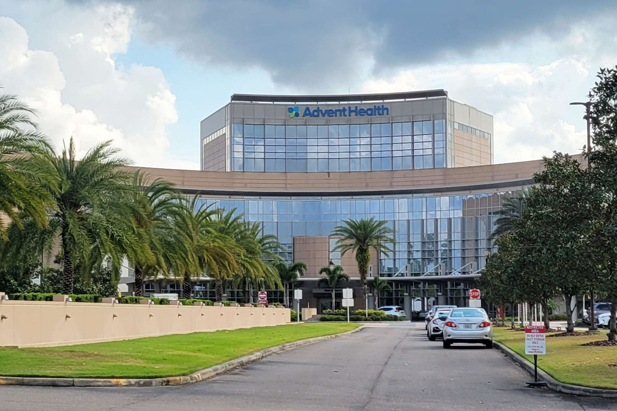 A photo of the hospital with the AdventHealth logo.