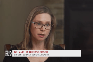 A woman with dark blonde hair wearing glasses and a black shirt sits in a chair and speaks. A lower third reads "Dr. Amelia Huntsberger" and "OB-GYN, Bonner General Health".