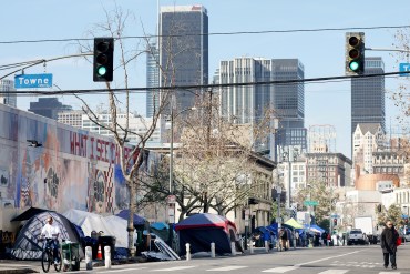 A photo of tents lining a street in California.