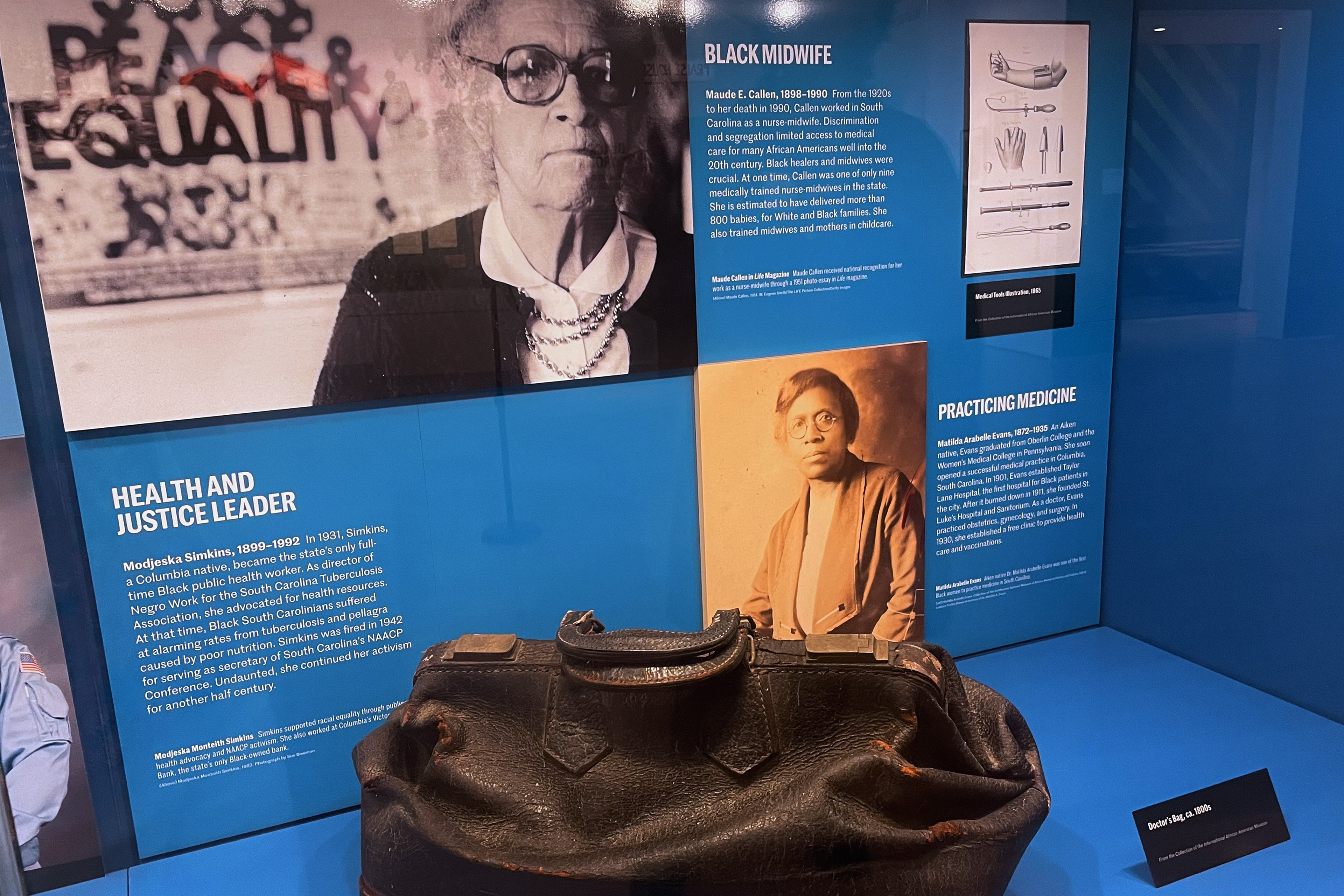 A photo of a museum exhibit showing a doctor's bag from the 1800s.