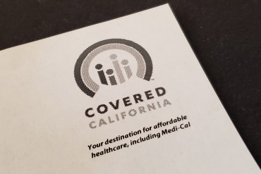 A photo of Covered California's logo on a piece of paper.