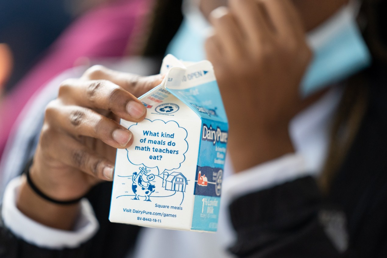 A student holds a milk carton at lunch at Burke County High School in Waynesboro, Georgia Wednesday, November 3, 2021. According to the U.S. Department of Agriculture, a school meal is not reimbursable without milk. (Photo by Sean Rayford for The Washington Post via Getty Images)