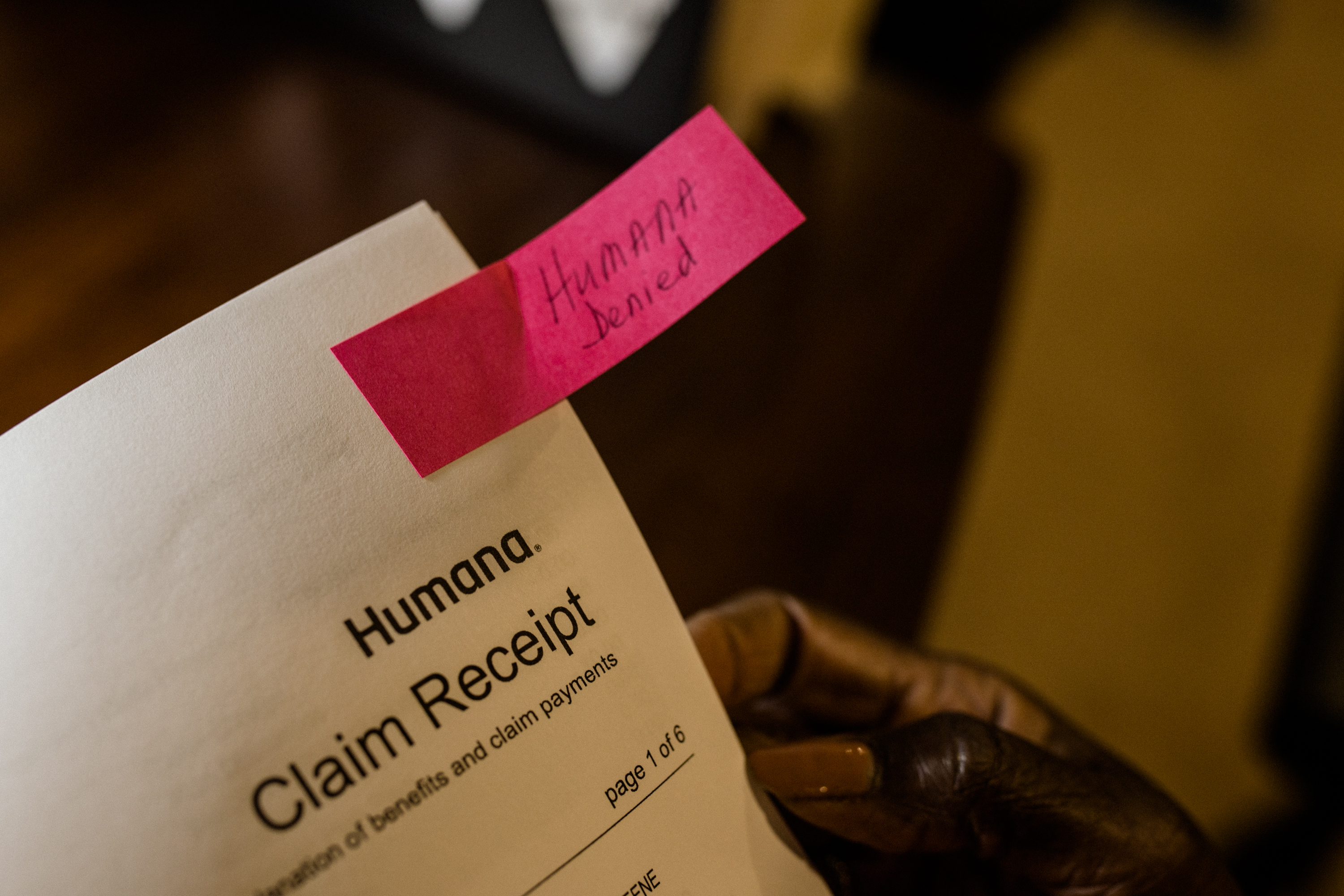 An up close photo of an insurance claim It reads Humana Claim Receipt At the top right corner there is a pink Post It note that reads Humana Denied in script