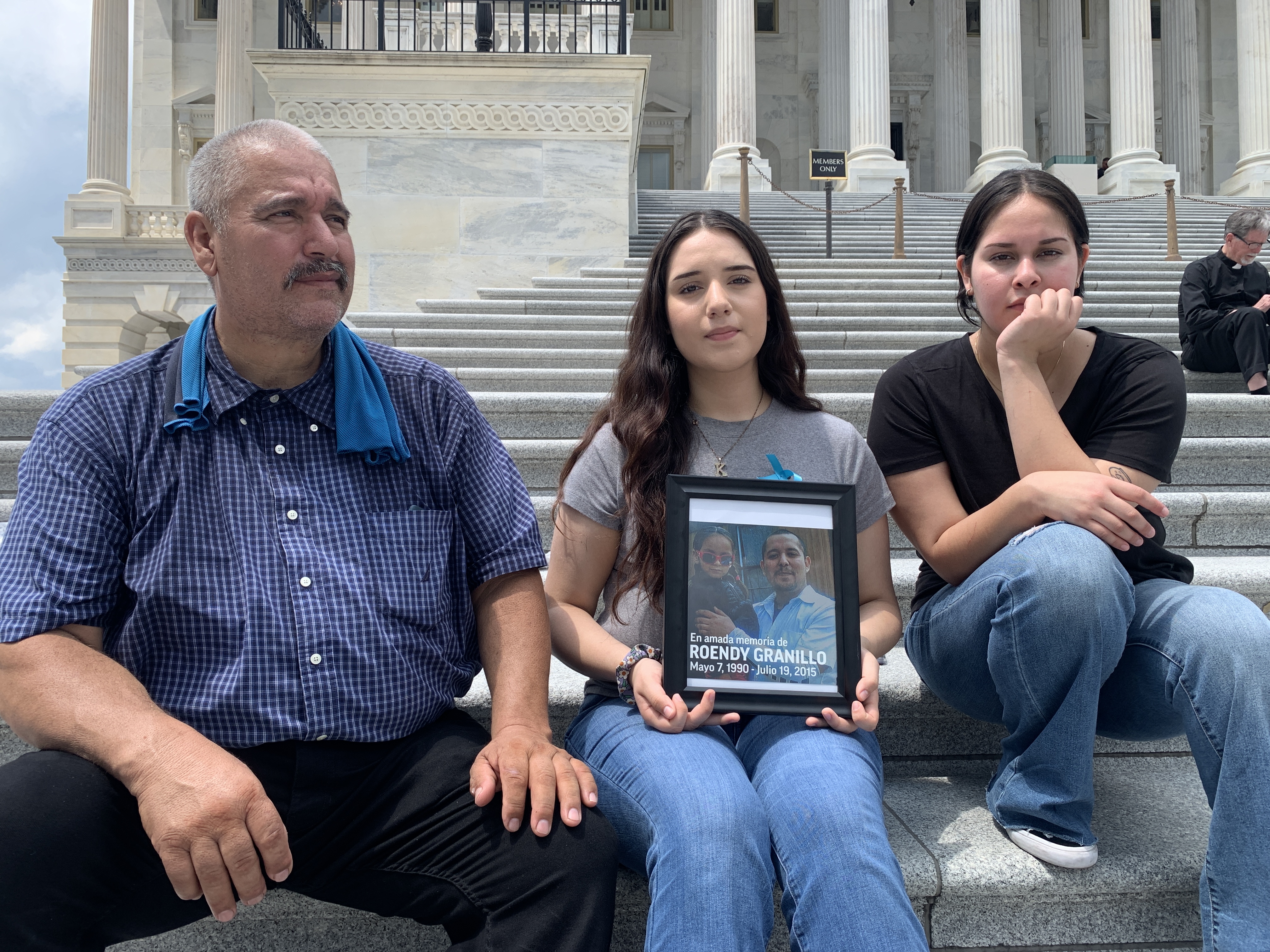 Breaking News Jasmine and Daisy Granillo take a seat beside their father on the steps of the U.S. Capitol. Daisy, centered between her two kinfolk, holds a framed photo of her gradual older brother.
