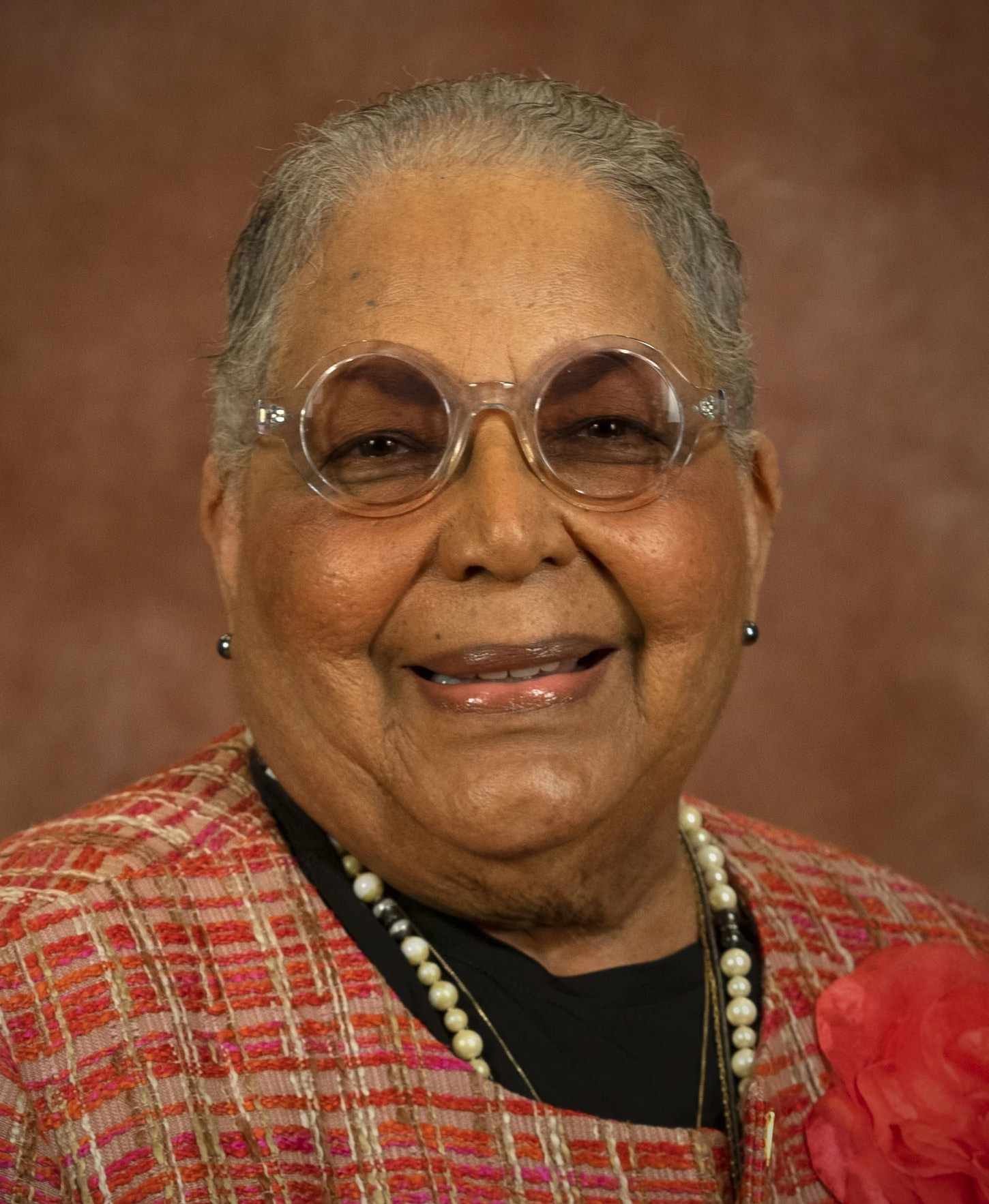 A photo of a Black woman posing for a portrait.